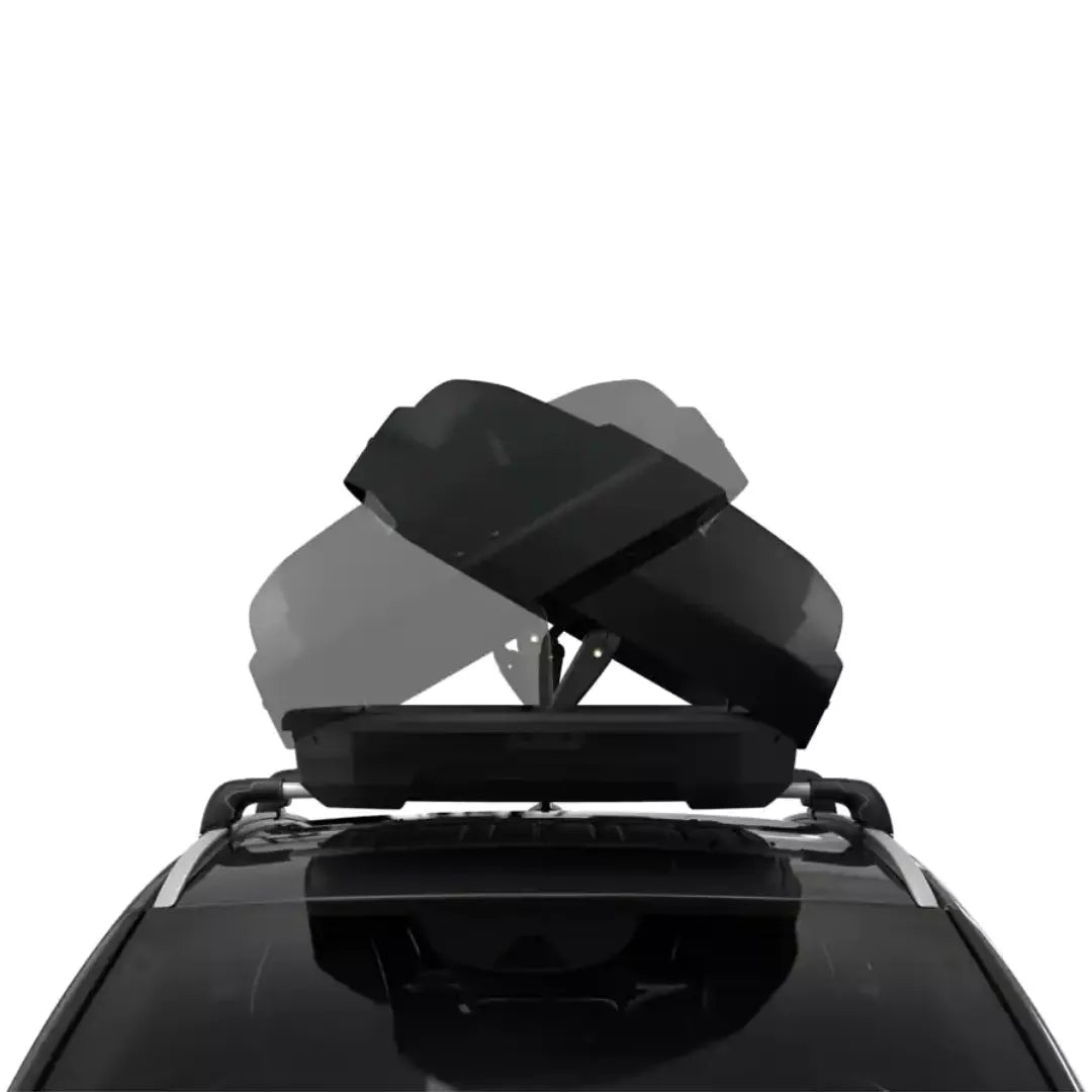 Top-down view showing the dual-sided opening mechanism of the Thule Force XT mounted on a vehicle.