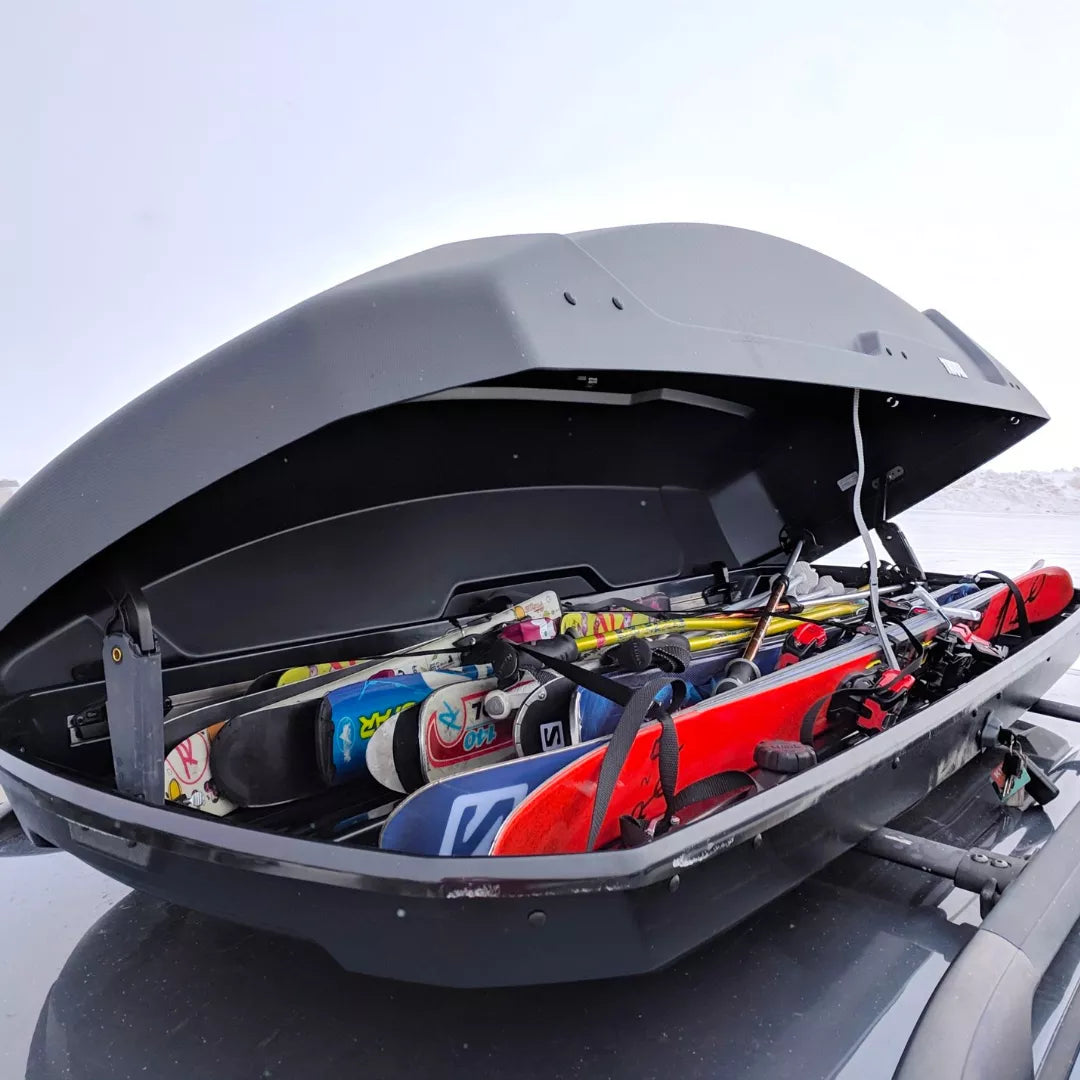 Interior view of the Thule Force XT packed with colorful winter sports gear and clothing.