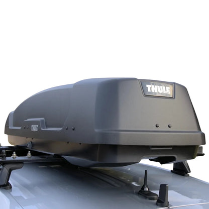 Thule force xt sport roof box mounted on a vehicle with a white background