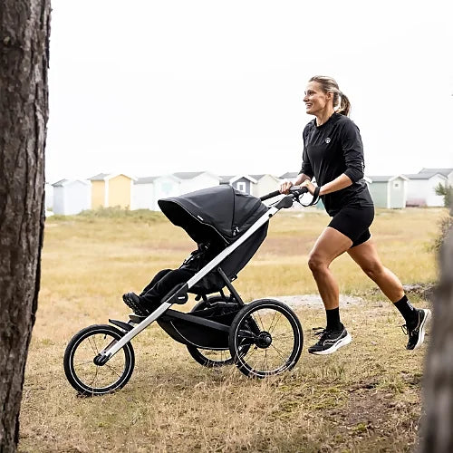 Front view of Thule Glide 3 running stroller displaying aerodynamic lightweight design and adjustable handlebar