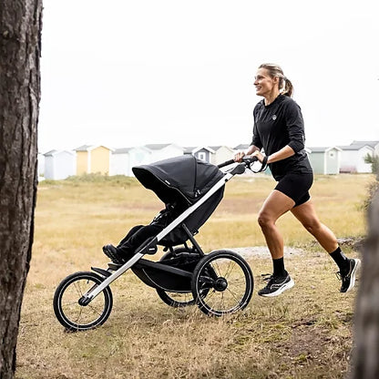 Front view of Thule Glide 3 running stroller displaying aerodynamic lightweight design and adjustable handlebar