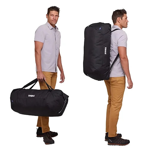 Thule GoPack Duffel Bag being carried by hand and worn as a backpack showing dual carry functionality