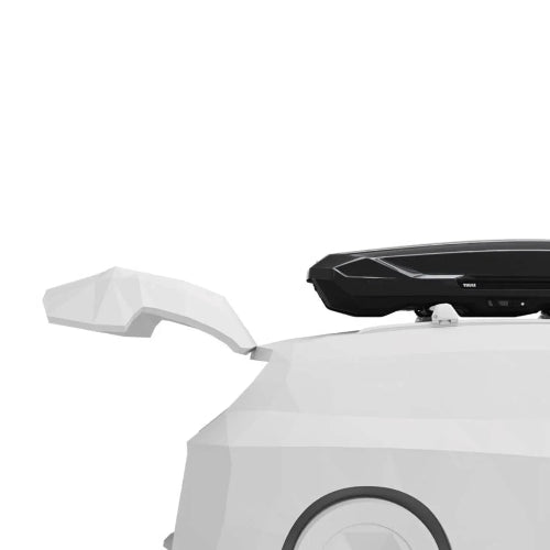 Close-up of Thule Motion 3 Low XL roof cargo box showing aerodynamic mounting on vehicle