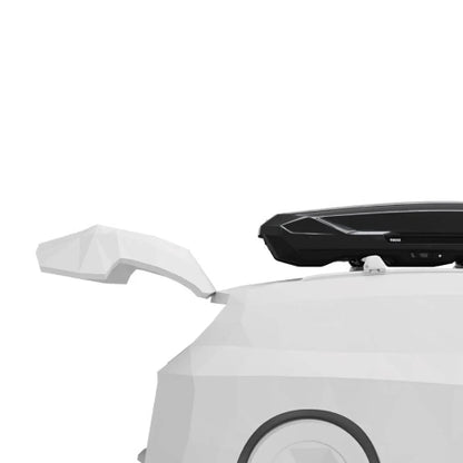 Close-up of Thule Motion 3 Low XL roof cargo box showing aerodynamic mounting on vehicle