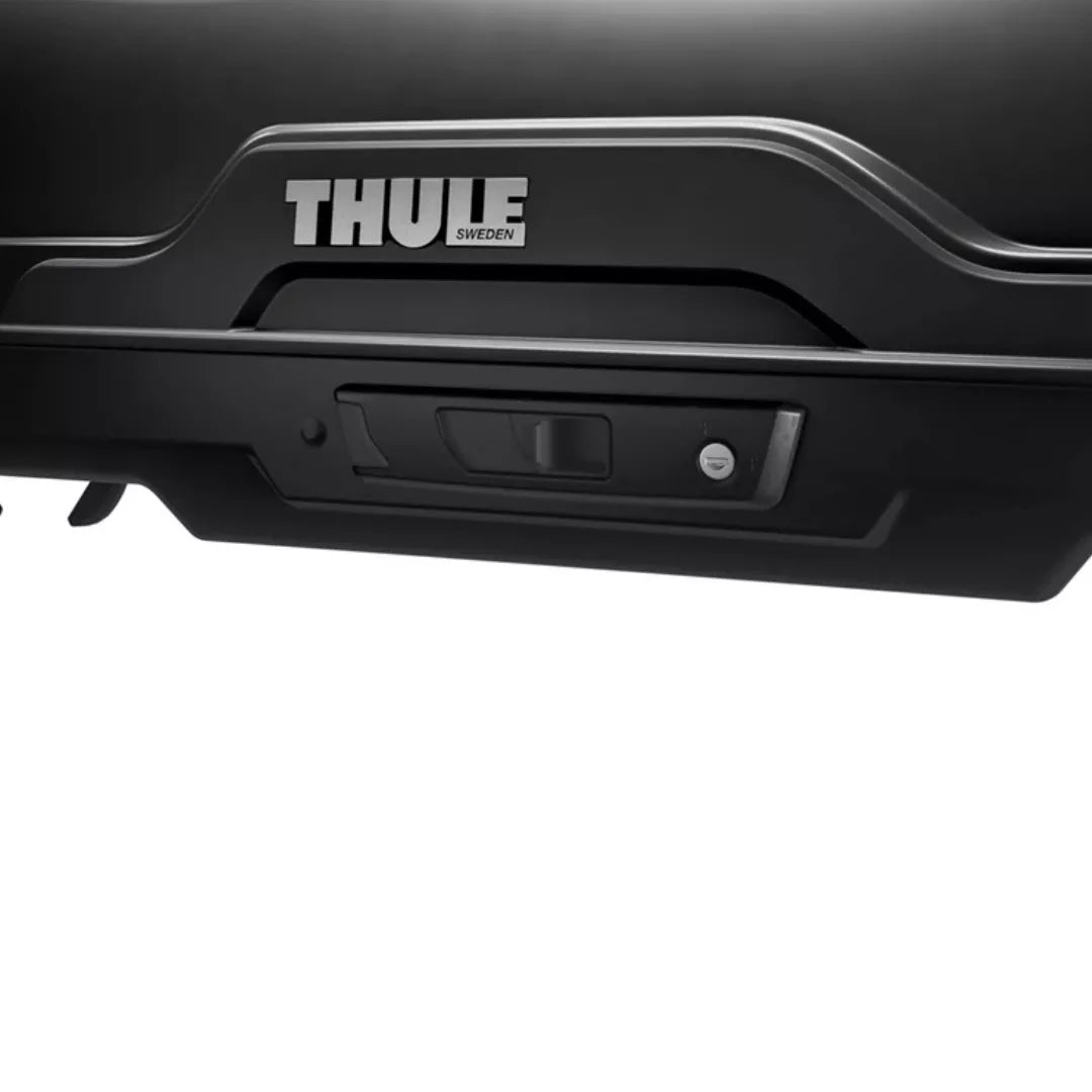 Close-up of the Thule SlideLock system with branding and lock indicator detail.

