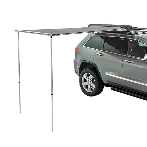 Thule OverCast awning extended from SUV roof rack providing shade