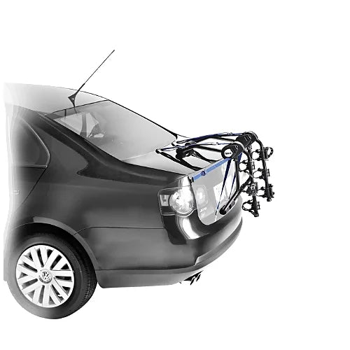 Thule Passage 3-Bike trunk rack securely mounted on sedan trunk, ideal for transporting multiple bicycles safely