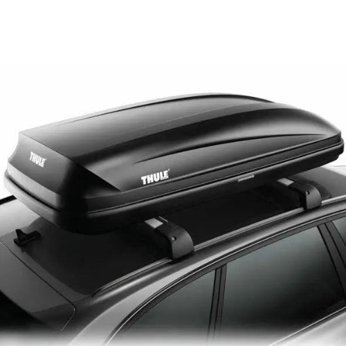 Thule Pulse aerodynamic roof cargo box close-up top angle showing secure FastGrip mounting and streamlined design