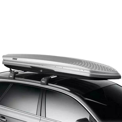 Thule Sonic silver cargo box mounted on roof rack, angled side perspective

