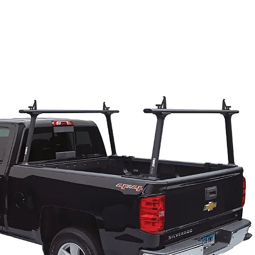 Thule TracRac TracOne black rack installed on black Chevy Silverado — rear view