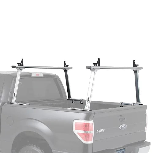 Side view of Thule TracRac TracOne silver rack mounted on Ford truck