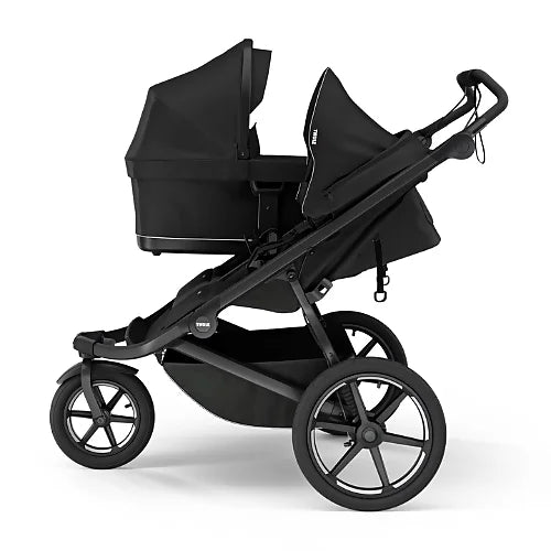 Side profile of Thule Urban Glide 3 double stroller with black bassinet installed