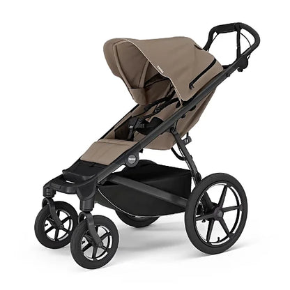 Thule Urban Glide 4-Wheel all-terrain stroller in tinted taupe side view with adjustable canopy and large air-filled wheels