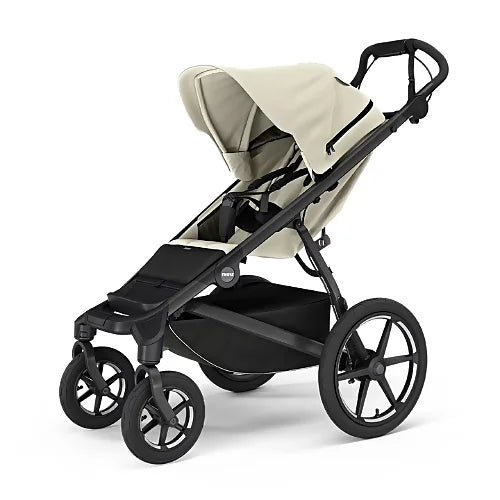Thule Urban Glide 4-Wheel stroller in beige with adjustable recline and large ventilated canopy