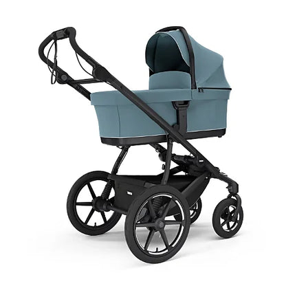 Thule Urban Glide 4-Wheel stroller with newborn bassinet in mid blue for travel system use