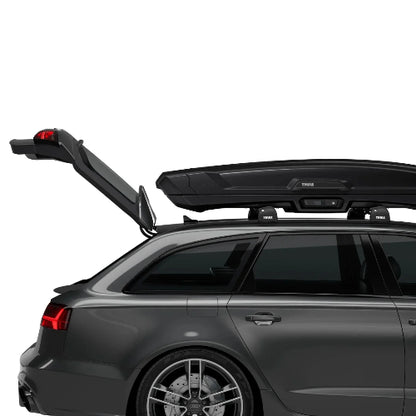 Thule Vector Alpine mounted on vehicle roof showing full trunk access and low-profile aerodynamic fit