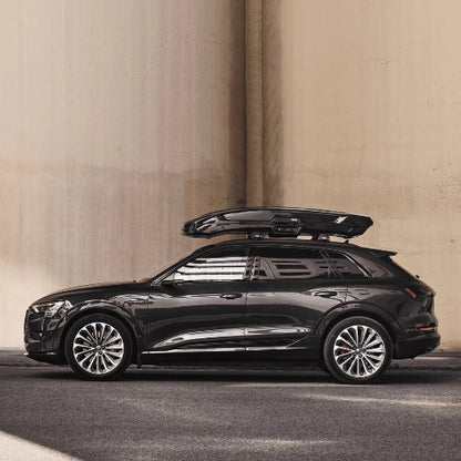 Thule Vector Alpine roof box side view mounted on SUV highlighting elegant aerodynamic shape and modern styling