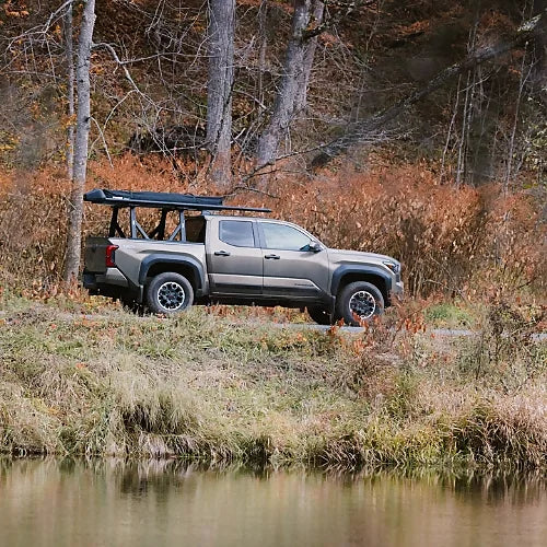 Thule Xscape truck rack on Toyota TRD Pro parked in forested trail