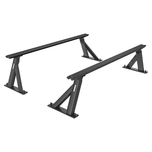 Angled view of Thule Xscape SR baserail truck rack uprights and aluminum load bars on white background