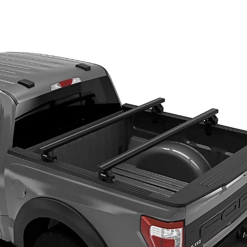 Thule Xsporter Pro Low black truck rack installed on pickup bed for rooftop tents or gear
