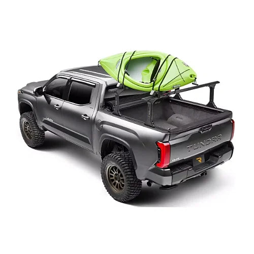 Truxedo Elevate Rack carrying green kayak on GMC Sierra with tonneau cover