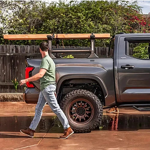 Truxedo Elevate Rack mounted on Toyota Tacoma hauling lumber across full bed