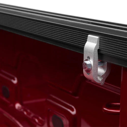 Metal tie-down hook attached to Truxedo Elevate TS Rail on red truck bed wall