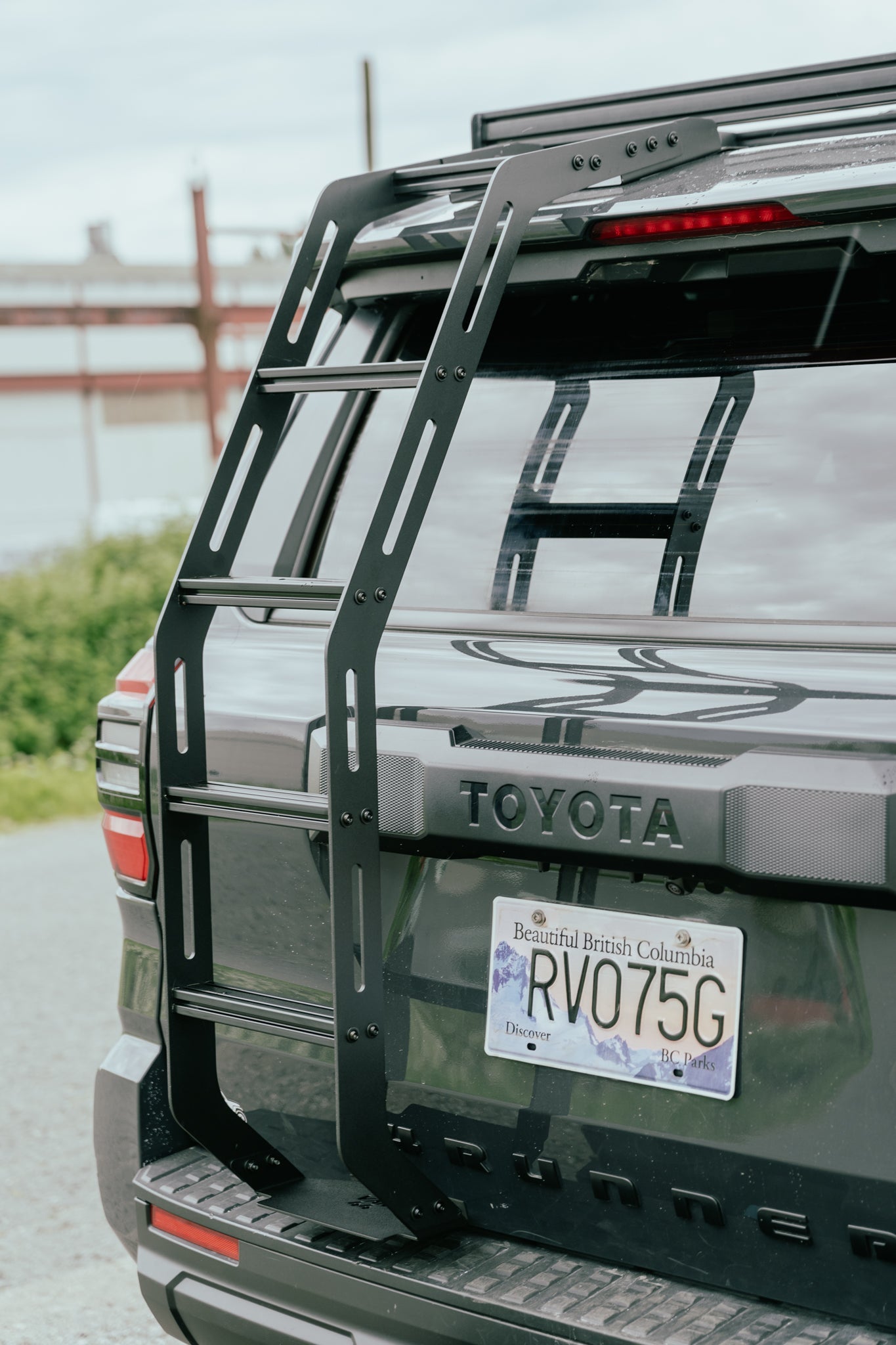 Back of a Toyota 4runner with a Van44 hatch ladder and British Columbia license plate.
