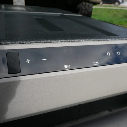 Control panel with power and temperature adjustment buttons on the Wabban fridge