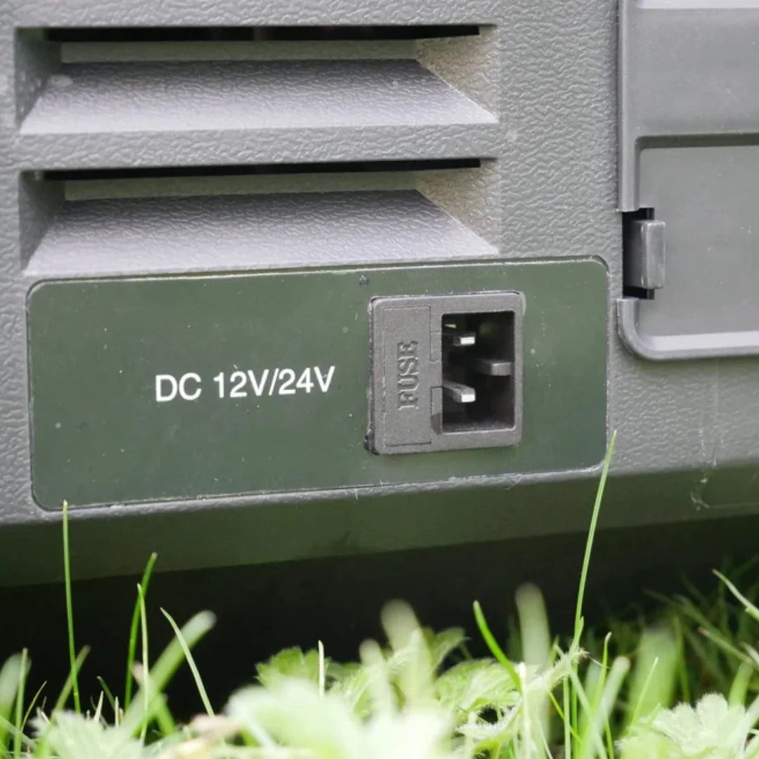 Close-up of DC 12V/24V input port on Wabban fridge exterior