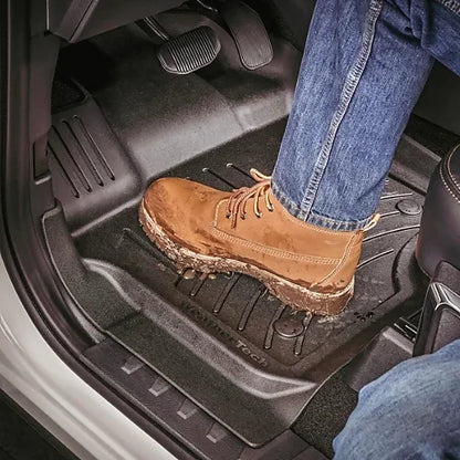 Front driver footwell with heavy-duty WeatherTech FloorLiner in black