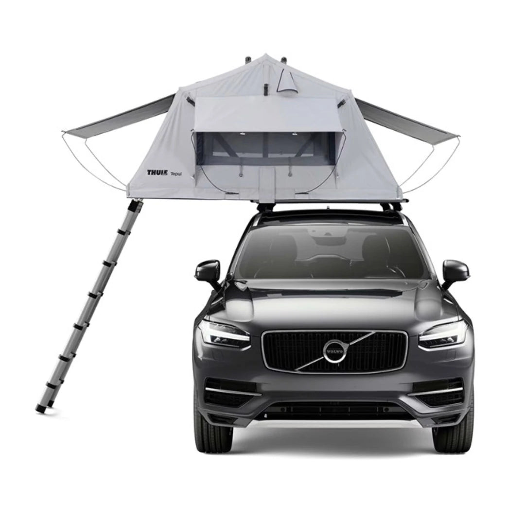 Front view of rooftop tent setup on SUV with ladder