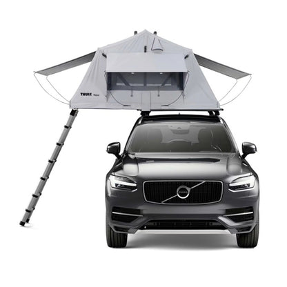 Front view of rooftop tent setup on SUV with ladder