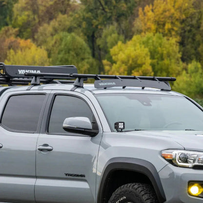 Yakima BaseLine Towers with crossbars and accessories installed on pickup truck roof for cargo and adventure gear