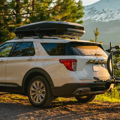 Yakima CBX mounted on Ford Explorer SUV in mountain setting