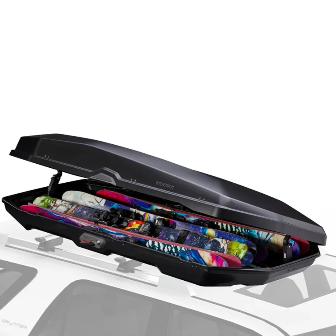 Yakima CBX roof box loaded with colorful skis up to 215 cm