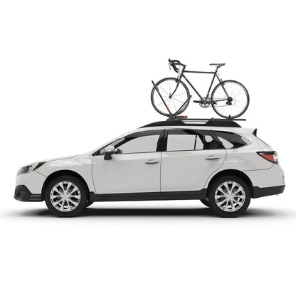 White wagon driving with a road bike mounted on the roof using the Yakima FrontLoader bike rack.