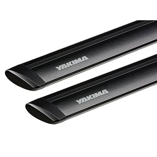 Close-up view of Yakima JetStream black crossbars showing aerodynamic teardrop profile and textured alloy finish