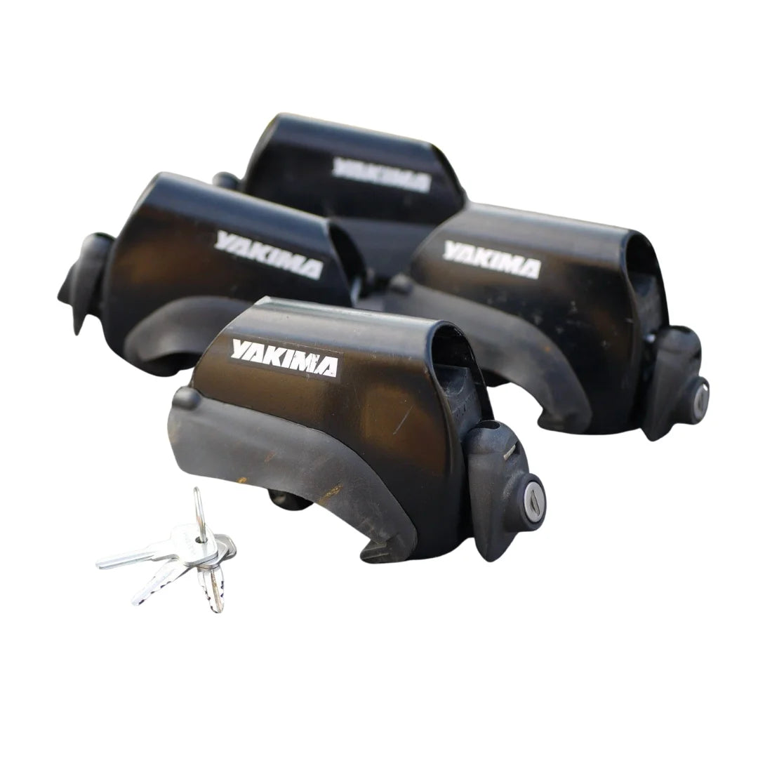 Set of four Yakima LowRider Max towers with included keys displayed on a white background

