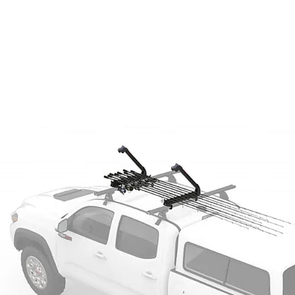 Yakima ReelDeal rooftop fishing rod rack mounted on pickup truck crossbars carrying rods