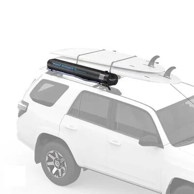 Yakima RoadShower installed on SUV roof alongside surfboards for outdoor travel and watersports adventures