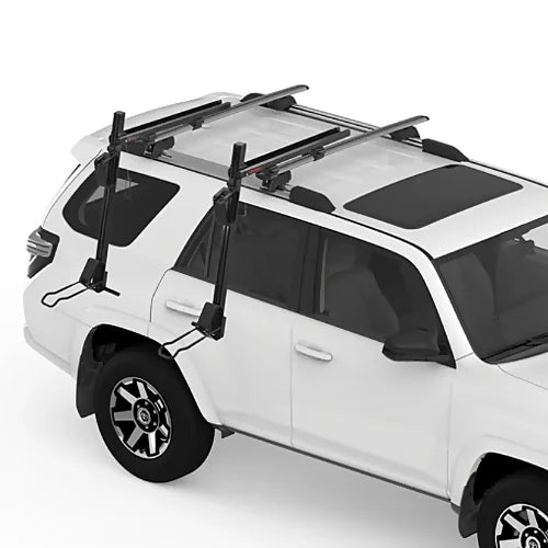 Yakima ShowDown roof rack kayak and SUP loader mounted on SUV roof rails.