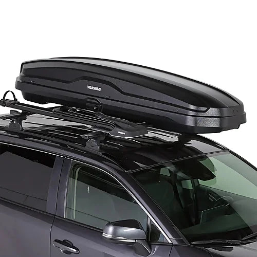 Yakima SkyBox NX Skinny cargo box mounted securely to SUV roof crossbars