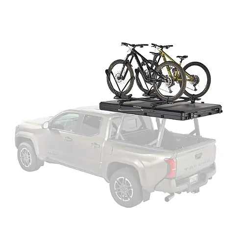 Two mountain bikes mounted on closed Yakima SkyPeak HD rooftop tent lid