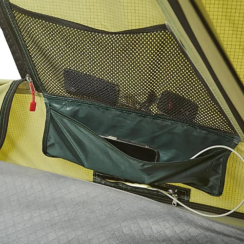Interior mesh and zippered gear storage pocket of Yakima SkyRise SL rooftop tent with phone inside
