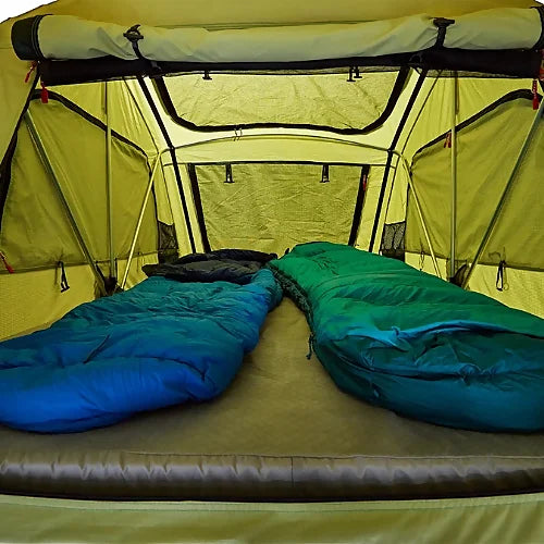Interior view of Yakima SkyRise SL rooftop tent with two sleeping bags on mattress