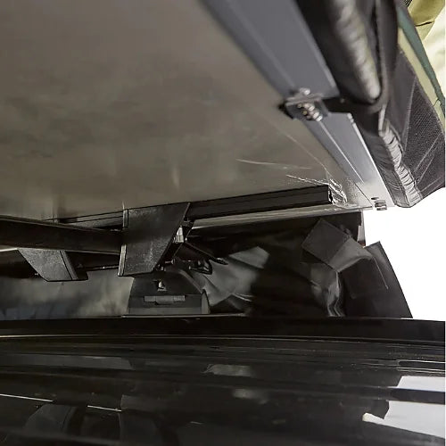 Close-up of Yakima SkyRise SL rooftop tent mounting hardware and bracket