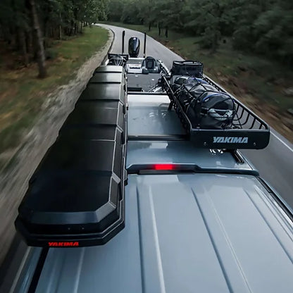 Overhead view of Yakima TopWater and Yakima cargo basket on roof of truck towing a boat
